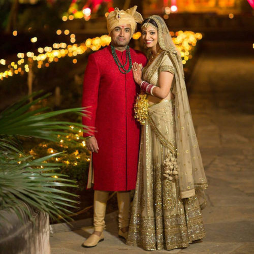 View more sherwani types Red with groom and Golden for Bride