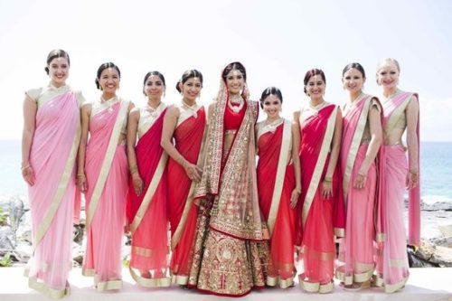 bridesmaids have picked red from the bride’s outfit