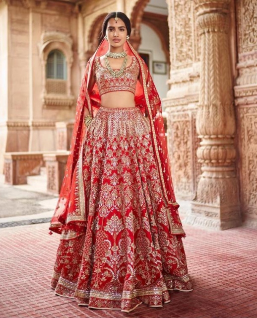 Anita Dogra's red designer bridal lehenga