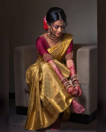 South Indian bride in golden Kanjeevaram saree