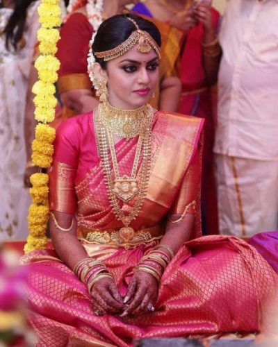 South Indian bride in pink Kanchipuram saree