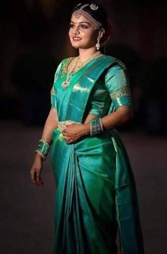 South Indian bride in aquamarine Pattu saree