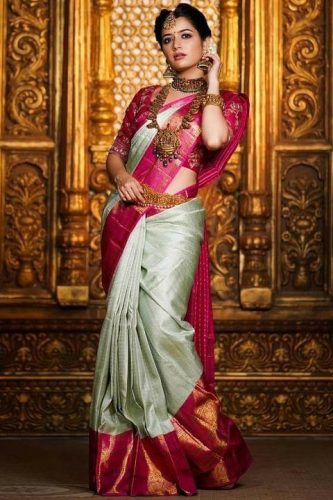 South Indian bride in silver saree with pink border