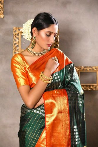 South Indian bride in Gadwal saree with orange border