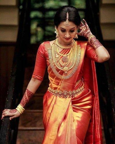 South Indian bride in Kanjeevaram saree with gold jewelry