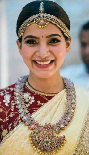 South Indian bride in cream and maroon saree