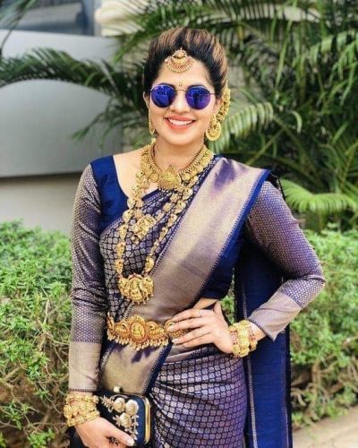 South Indian bride in blue Kanjivaram saree