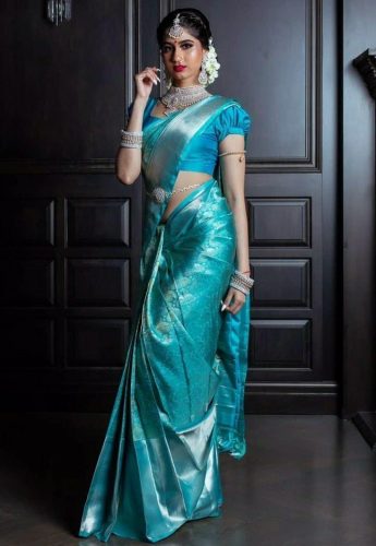 South Indian bride in teal and silver saree