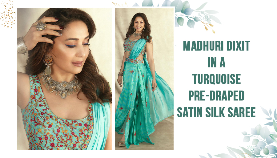 Madhuri Dixit in turquoise satin silk saree