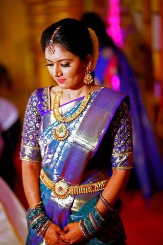 South Indian bride in royal blue Kanjeevaram saree