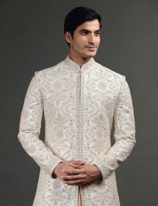 Cream and peach groom sherwani in raw silk