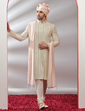 Cream hue raw silk sherwani for grooms