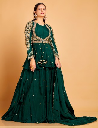 Dark green lehenga choli with a dupatta