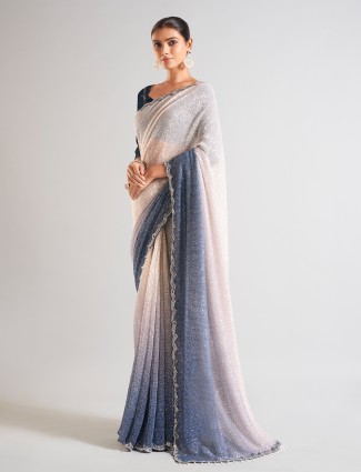 Trendy cream and blue sequins saree
