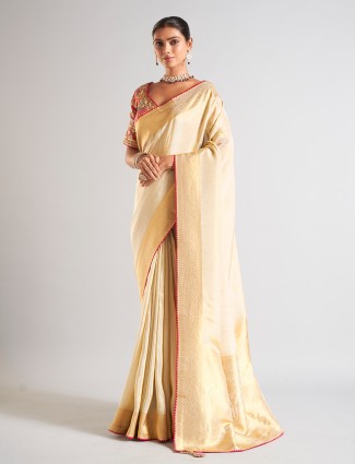 Golden radiance tissue silk saree with royal embellishments
