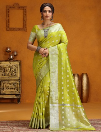 Lime green silk saree with silver zari weaving
