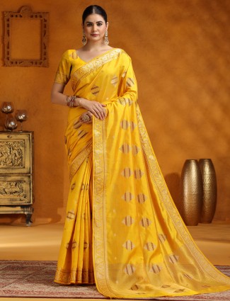 Yellow silk saree adorned with zari weaving