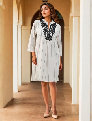 Classic white cotton kurti embellished with delicate thread detailing