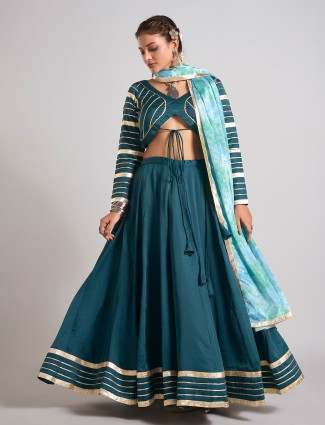 Bottle green silk chaniya choli with intricate gota work