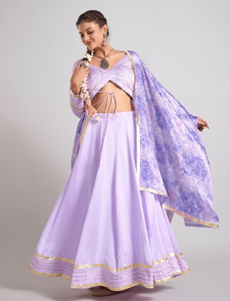 Lavender silk chaniya choli paired with traditional dupatta