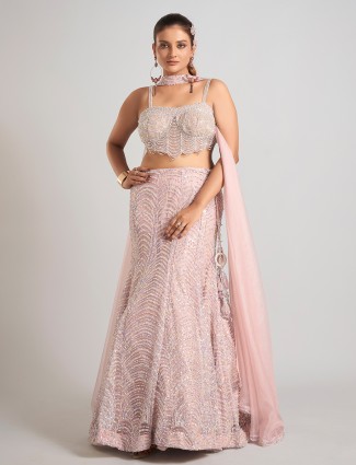 Light pink net lehenga choli with sleeveless choli