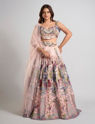 Pink net wedding lehenga choli with shimmery finish