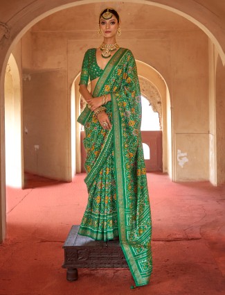 Green patola silk saree for festive occasions