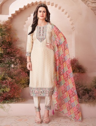 Beige silk salwar suit with multicolor dupatta accent