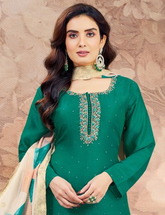 Graceful dark green sequins worked silk salwar suit