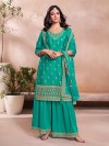 Rama green silk palazzo suit paired with printed dupatta