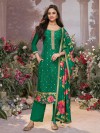 Green silk salwar suit adorned with classic zari work