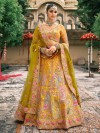Yellow silk haldi lehenga choli with festive detailing