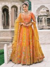 Orange and yellow silk lehenga choli highlighted with sequins glow