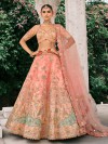 Peach silk wedding lehenga choli with refined embellishments