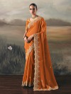 Rust orange tissue silk saree for festive celebration