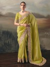 Emerald green tissue silk saree with intricate embellished border