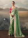 Pista green tissue silk saree with bold maroon contrast blouse