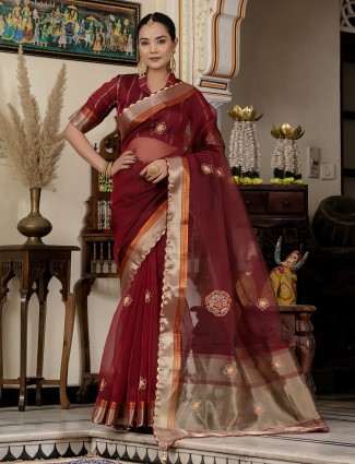 Elegant maroon linen saree with traditional zari weaving