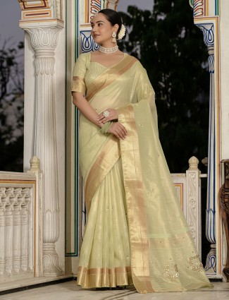 Golden radiance tissue silk saree with royal embellishments