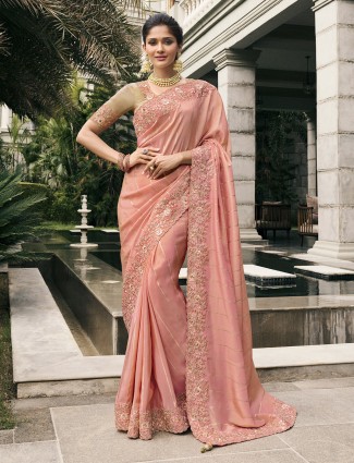 Peach tissue silk saree with intricate zari and zardosi