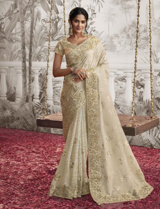 Golden radiance tissue silk saree with royal embellishments