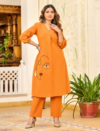 Orange silk suit with vibrant seasonal vibes