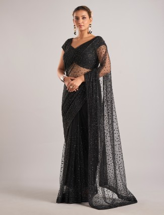 Black net saree featuring cutdana and stone detailing