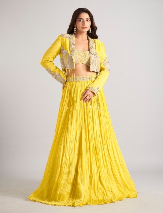 Yellow silk jacket style lehenga choli accented with cutdana