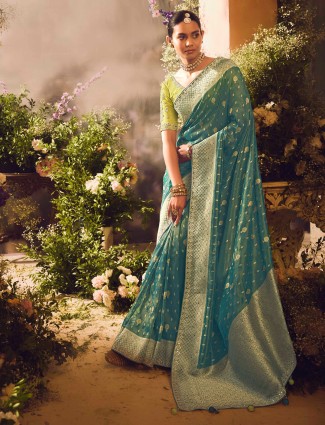 Traditional teal blue saree with zardosi detailing