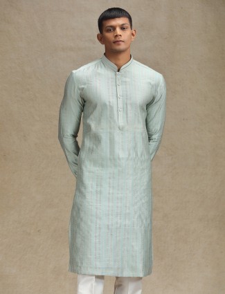 Mint green kurta pajama featuring a chic textured stripe design