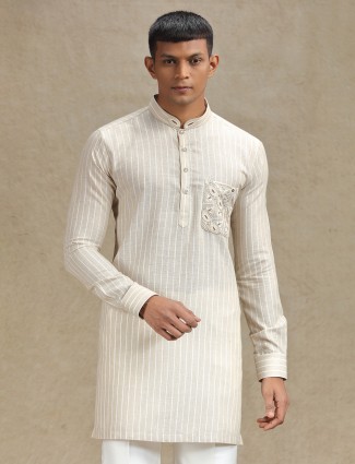 Serene natural beige kurta set adorned with elegant embroidery