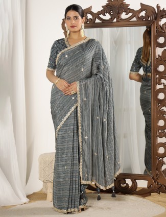 Grey muslin saree in festive print style