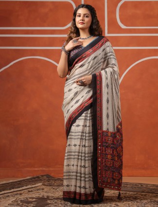 Ivory muslin saree with printed design and blouse