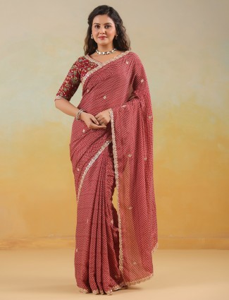 Bold red muslin saree with coordinated blouse